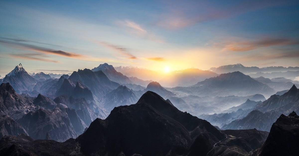 A Canyon With A Mountain In The Background