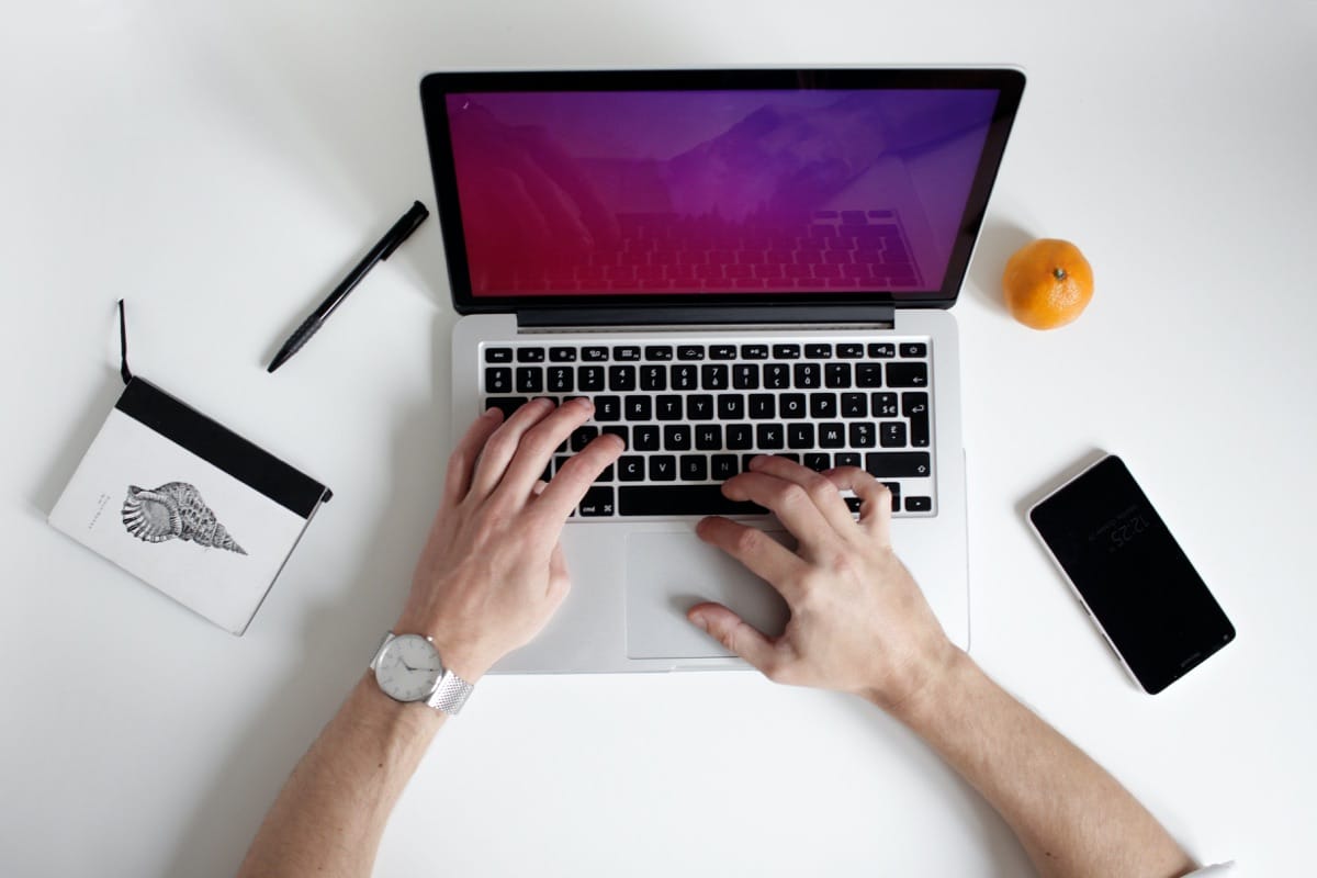 a man holding a laptop